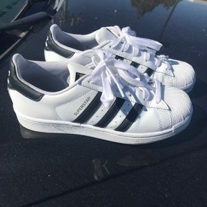 Adidas gold,white, and black Superstar sneakers